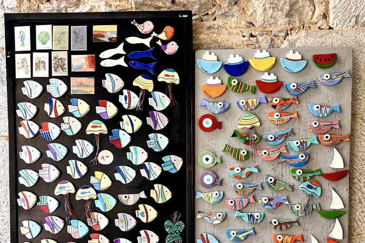 Handmade magnets shaped like fish and boats at RIZA Gift Shop in Kardamyli, Mani, Greece